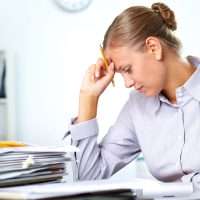 Lady stressing over documents